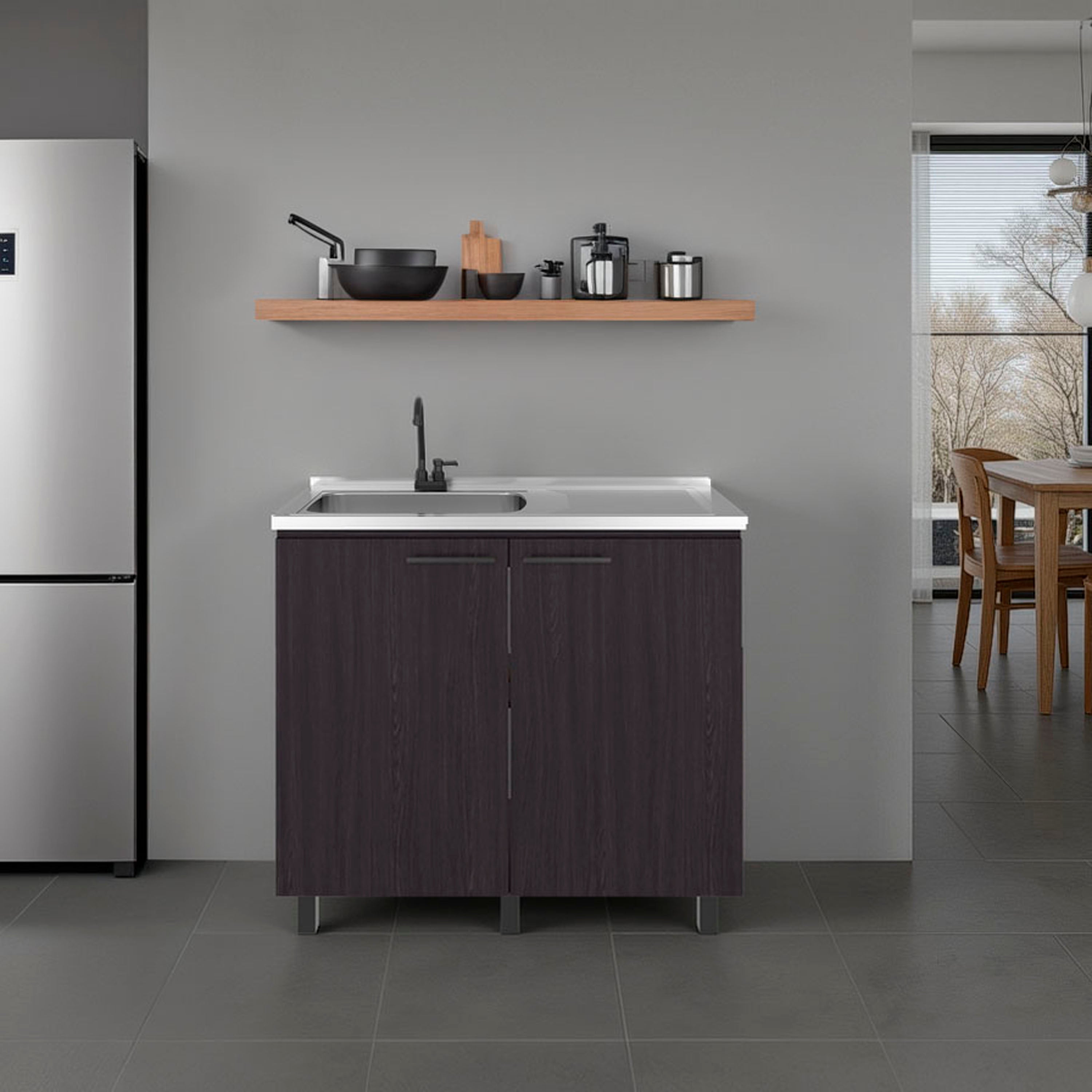 Modern kitchen setup with a stainless steel counter top, sink unit, and shelves.